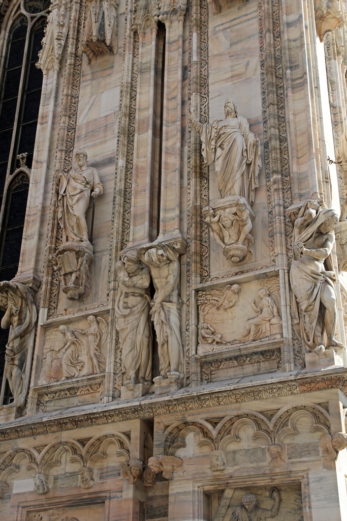Statues Holding Up Corner of Church