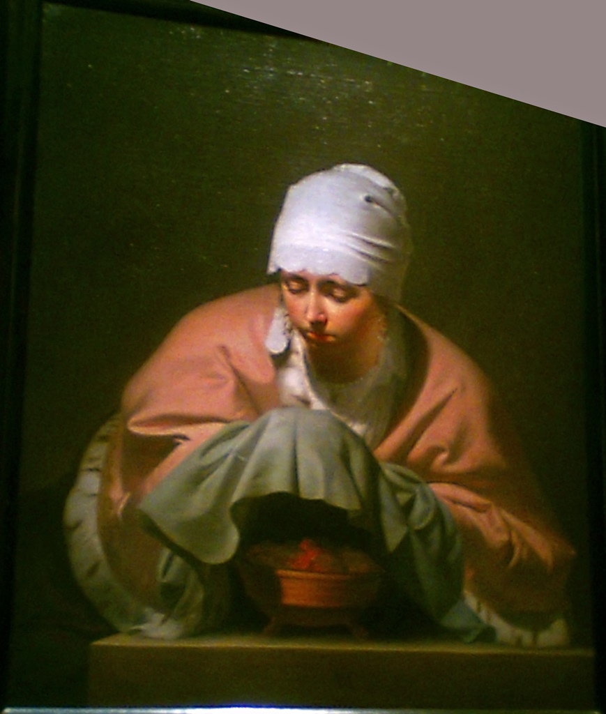 A Young Woman Warming her Hands